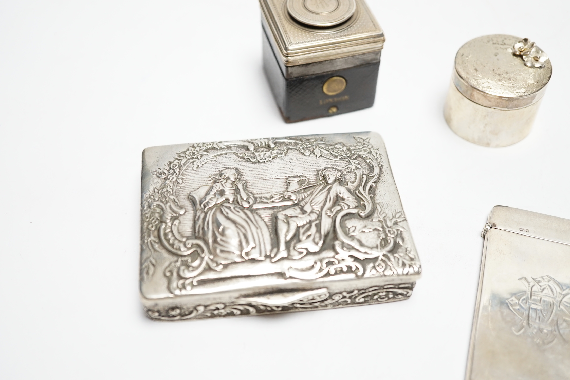 A German embossed 800 standard white metal snuff box, 87mm a silver card case, a modern silver drum shaped box(a.f.) and a silver mounted inkwell .